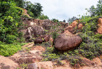 Brown rocks boulders in a jungle mud tropical landscape malaysia