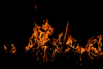 Fire sparks background. Abstract dark fire flames background. Background of flames blazing. Blaze flames background with copy space. Burning fire concept.