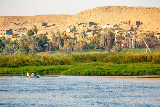 Egypt. Men rowing a small boat in the Nile.
