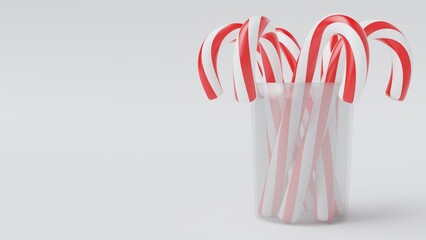 Christmas Candy Canes on Glass Pot on White Background.