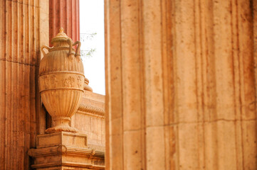 Ornate Columns and Urn at Urban Landmark in Warm Sunlight