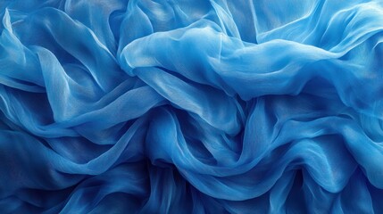 Fototapeta premium Blue silk fabric texture background.