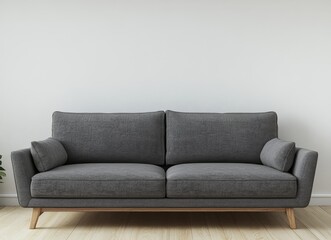 A gray fabric sofa with wooden legs sits in a room with white walls and wooden floors.
