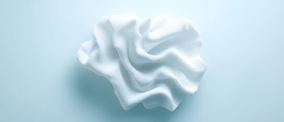 soft white fabric draped elegantly on a light background