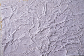 white crumpled and creased glued wrinkled paper poster texture background