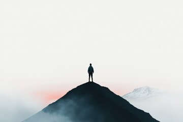 a solitary figure standing on a mountain peak at sunrise