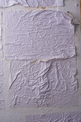 white crumpled and creased glued wrinkled paper poster texture background