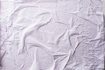 white crumpled and creased glued wrinkled paper poster texture background