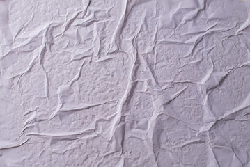 white crumpled and creased glued wrinkled paper poster texture background