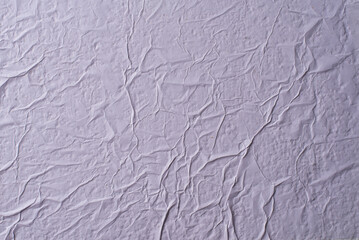 white crumpled and creased glued wrinkled paper poster texture background