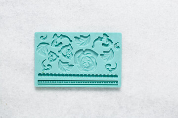 Overhead view of green silicone fondant mold, top view of green silicone mold for fondant and...