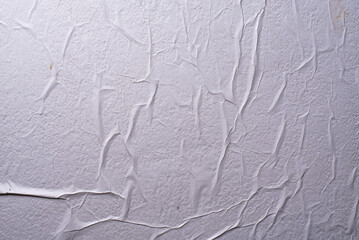 white crumpled and creased glued wrinkled paper poster texture background