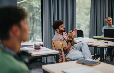 A diverse group of students interacts with an elderly professor in a modern classroom environment, promoting active learning and open communication.