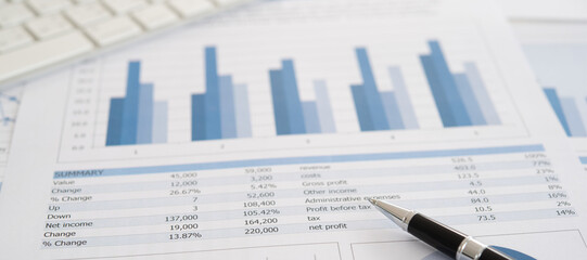 accounting bookkeeping business concept. balance sheet and account audit report on accountant desk.