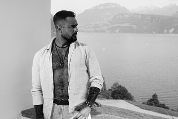 Portrait of the handsome man outside. A Hipster guy model headshot. Male face. Hispanic handsome man. Confident male model. Man looking proud. Closeup face of attractive man. Elegant guy.