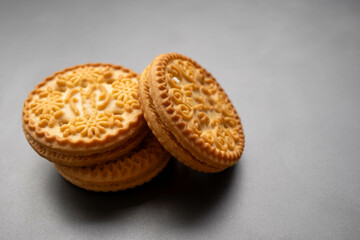 An isolated biscuit on a gray background with sample copy space image