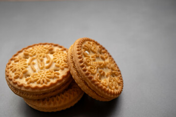 An isolated biscuit on a gray background with sample copy space image