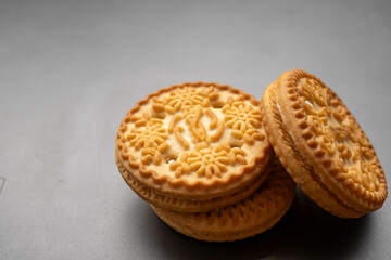 An isolated biscuit on a gray background with sample copy space image
