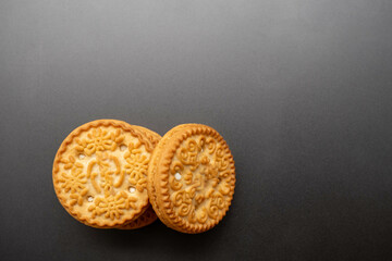 An isolated biscuit on a gray background with sample copy space image