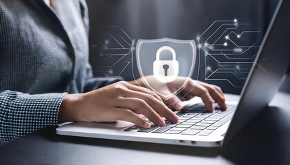 Person hand using laptop with digital shield and padlock icon overlay on image.