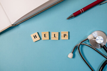 Wooden block with the word help written on it