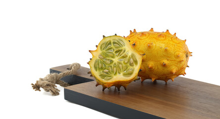 Ripe horned cucumber, also known as spiked melon cut to reveal its unique interior isolated on white