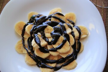 African Dessert: Sliced Bananas Drizzled with Rich Chocolate Sauce