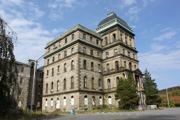Multi-Story Stone Building with Cupola and Adjacent Structure