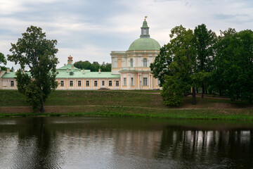 Fototapeta premium The Great (Menshikov) Palace from the side of the Lower Pond in the Oranienbaum Palace and Park Ensemble on a sunny summer day, Lomonosov, St. Petersburg, Russia