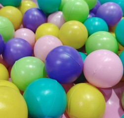 A variety of small, colorful plastic balls that create a fun and lively atmosphere.