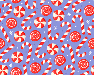 Seamless Christmas pattern with red and white striped candy canes and round sweet candies on a blue background. New Year's pattern for wrapping paper, textile, print.