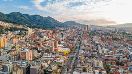Aerial View of Bogotá's Vibrant Urban Landscape with Modern Architecture and Majestic Mountains