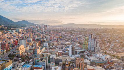Aerial View of Bogotá, Colombia's Modern Cityscape Surrounded by Mountains