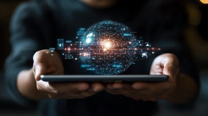 A person holding a tablet with a futuristic digital globe representation.