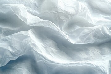 Obraz premium An abstract close-up of soft, wrinkled white fabric with delicate folds, offering a minimalistic and elegant texture for backgrounds and design projects
