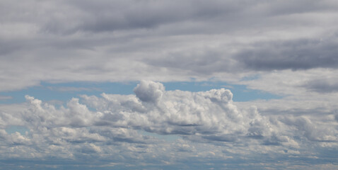 Sky replacement clouds puffy gray and white with blue sky