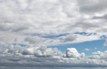Sky replacement clouds puffy gray and white with blue sky