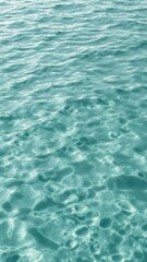 Rippling surface of water with small waves creating a soothing and fluid watery texture, abstract