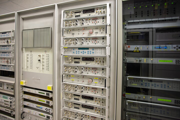 RF switch equipment frequency convertor in a data center, rack server, satellite connections equipment indoors at the station, emission analyzers