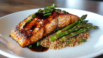 Savoring pan-seared salmon with quinoa pilaf and steamed asparagus at a gourmet kitchen a culinary delight