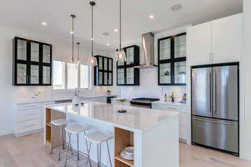 A modern kitchen with stainless steel appliances and a large island