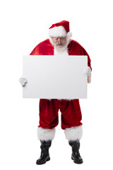 Smiling Santa Claus standing up on white background holding and looking down on a blank white sign for Christmas holiday advertising ad or copy space