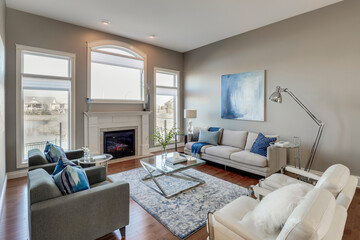 A living room with a fireplace, a couch, and a coffee table
