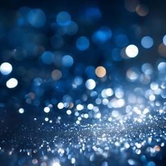 Fototapeta premium Fond bleu foncé avec effet bokeh de lumières blanches argentées et bleues scintillantes, espace négatif pour texte, arrière-plan festif, carte de vœux, publicité produits de luxe, Noël, nouvel an.