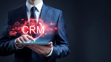 CRM customer relationship management. businessman holding a tablet with a virtual interface of CRM, CRM software, sales automation, CRM tools, customer service, sales management	