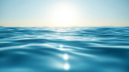 Vast blue ocean waves reflect sunlight under a clear sky in a tranquil setting