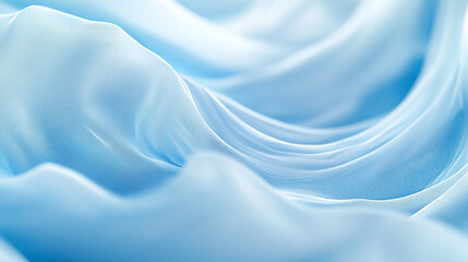 Fototapeta premium Soft blue fabric drapes creating gentle waves and folds for a serene visual