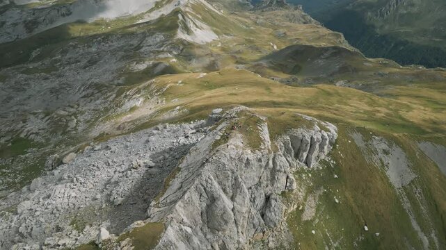 Korab Mountain summit in Albania with rugged terrain and sweeping green landscape in the background