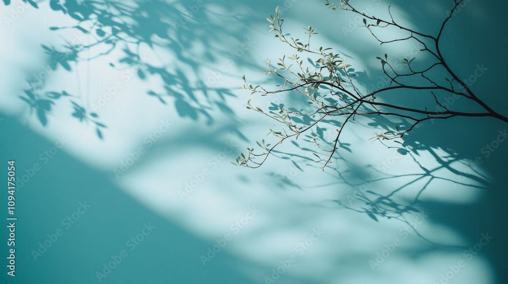 Aufkleber Shadows of branches creating intricate patterns on a calming blue wall