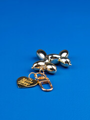 Funny golden  dog keychain on desk with stationery
